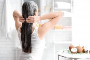 woman treating her hair at home